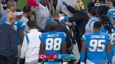 Chargers receiver Donald Parham is carted out in a shaking, fencing condition after a first quarter injury