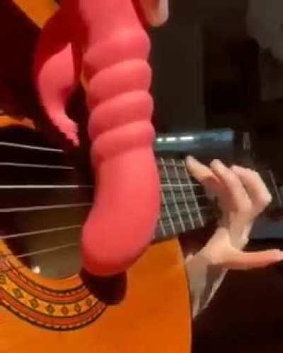 Playing guitar in a interesting way