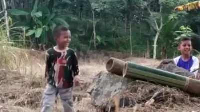 Kids playing with Homemade Bamboo Cannon