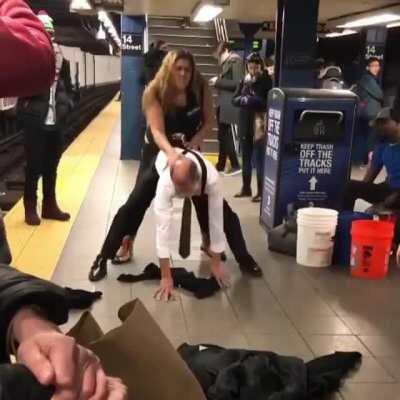 Random New Yorkers dancing on the subway platform.