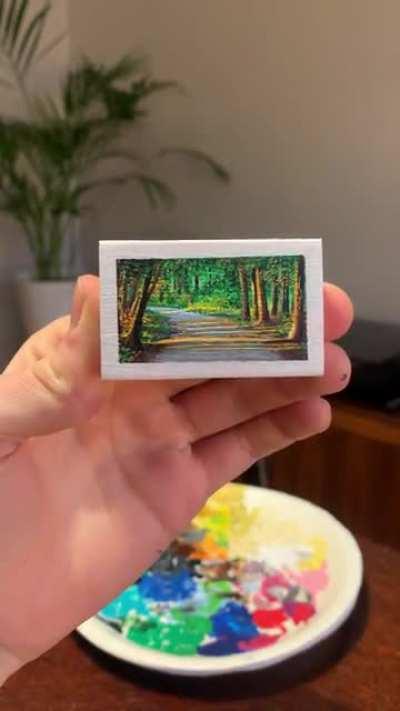 Peeling the tape off my matchbox painting