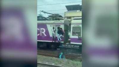 Man Falls Off Speeding Train After Hitting Pole