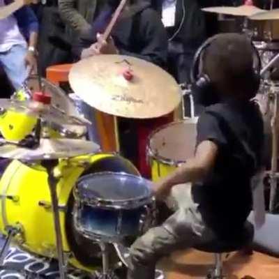 Young boy goes off on a drum solo