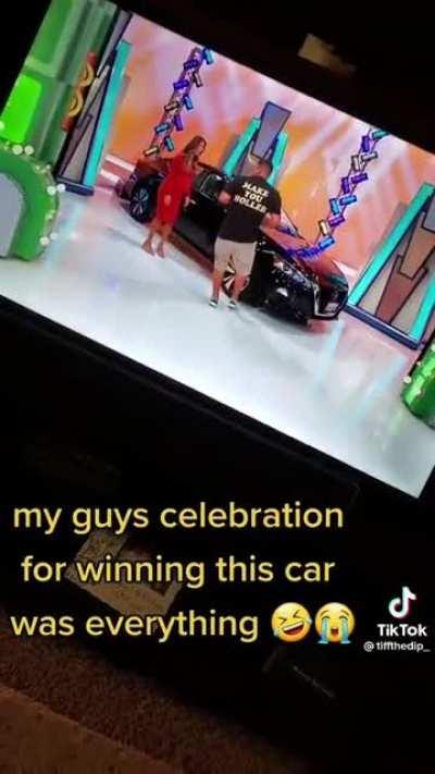 Celebrating winning a car in tv show