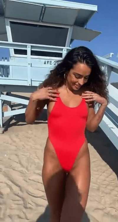 red one piece on beach - Snapchat, April 2023