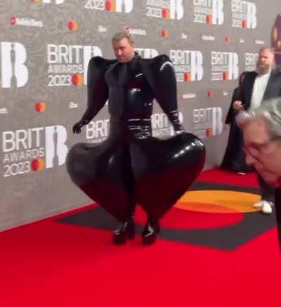 Sam Smith Rocks Latex Jumpsuit at the 2023 Brit Awards.