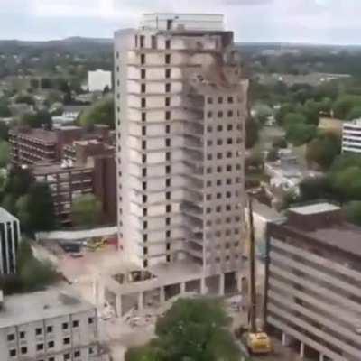 A tidy demolishing of a building.