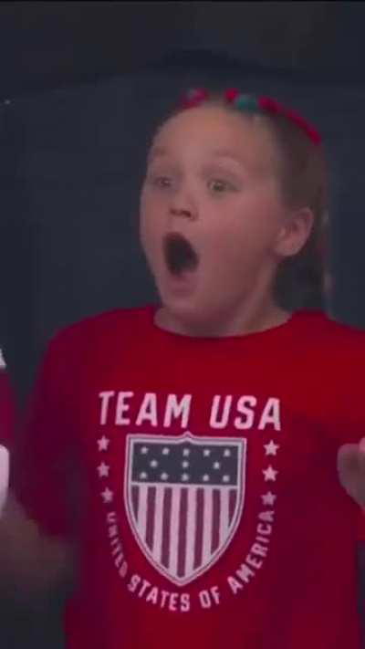 Olympic Gold Medalist Katie Ledecky waves at her biggest fan