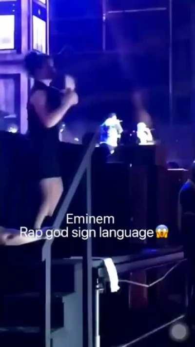 A woman doing &quot;rap god&quot; in sign language