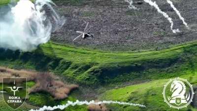 A pair of Army Aviation Mi-24s making a rocket attack on Russian targets in Pokrovsky direction. Filmed by drone of the 47th Mechanized Brigade, June 2024.