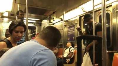 Racist yells at a family on the subway