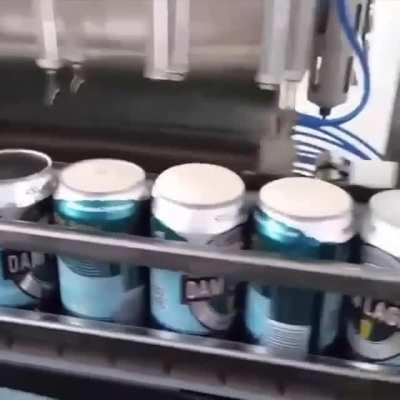 The process of filling beer cans