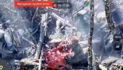 A Russian soldier gets split apart after a drone strike (Graphic)