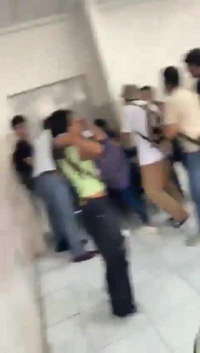 Students scramble to take cover on an university on Ecuador taken by armed gangs.