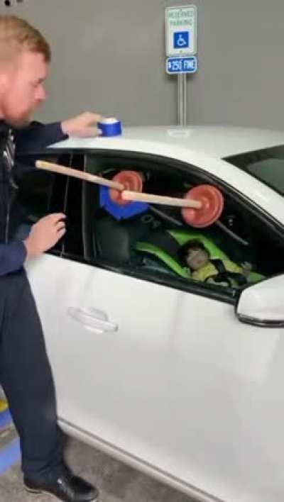 Police save baby and man from being stuck in car.