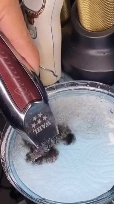 The way this barber disinfects his shaver