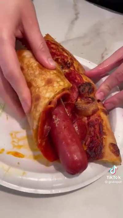 Is-is that a hotdog wrapped in pizza…? Why? Why would you do it?