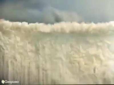 This is 1923 and what you are seeing is a biplane creating a huge, dense smokescreen, hundreds of feet tall, masking military units and their movement.