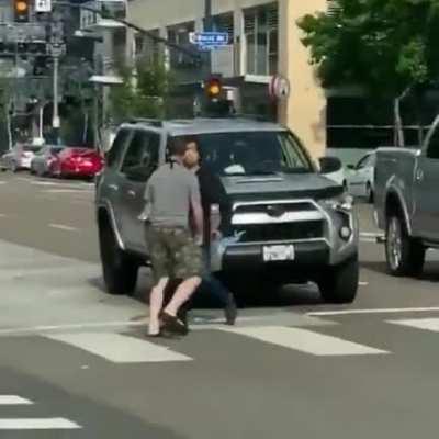 Guy tried his best to avoid fight, swiftly took out the agitator, then apologized