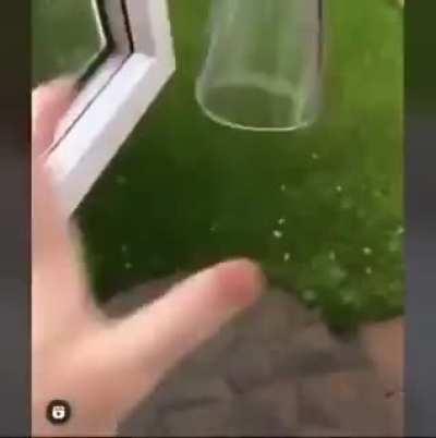 Trying to flip a glass cup onto a table