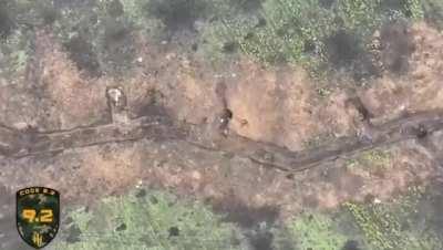 A Russian soldier was happily using an improvised toilet in the trenches when suddenly a Ukrainian drone dropped a grenade on him.