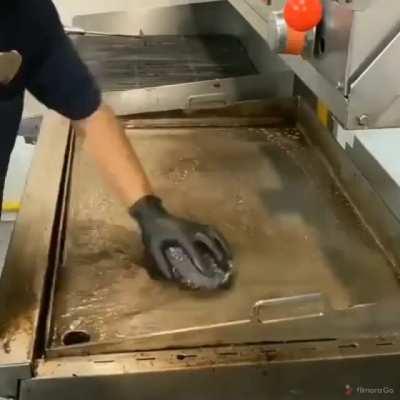 Cleaning a cooking station