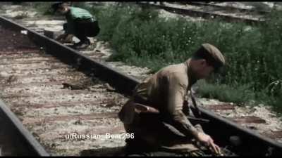 Soviet Partisans blow up a train track , German occupied Belorussia (1943) . Colorized by me.