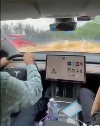 Another Tesla seen from inside wading on a flooded highway in China. Not recommended but works.