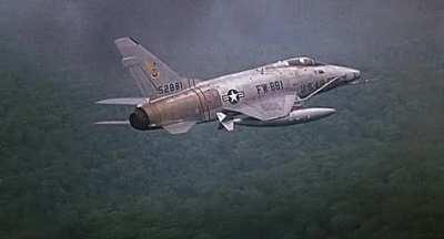 F-100 dropping finless napalm canisters somewhere over South Vietnam early in the war. Footage used in the “Bat 21” 1988 movie. [gif]