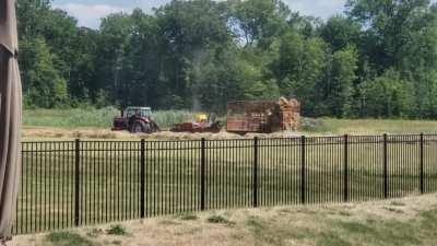 The field behind my house grows hay for the local zoo. I didn't realize they were thrown that far.