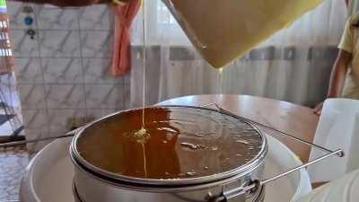 My dad and I sorting the honey