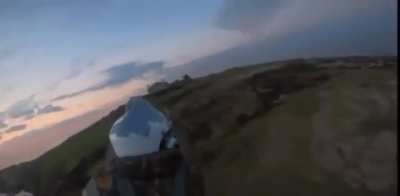 Two soldiers of the GUR (Defense Intelligence of Ukraine) flying over Zmiinyi Island (Snake Island) and planting a Ukrainian flag shortly after the Russians fled. June 2022