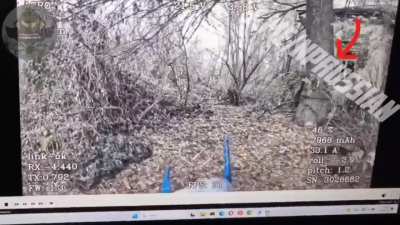 Ru Pov: Fiber-optic FPV drone going after a Ukrainian soldier hiding behind a tree.