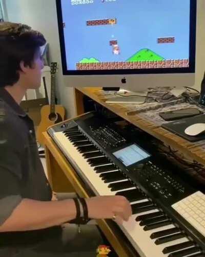 Paying the music of Mario to someone playing the game