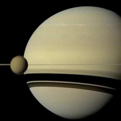 Timelapse of Europa and Io orbiting Jupiter captured by the Cassini probe