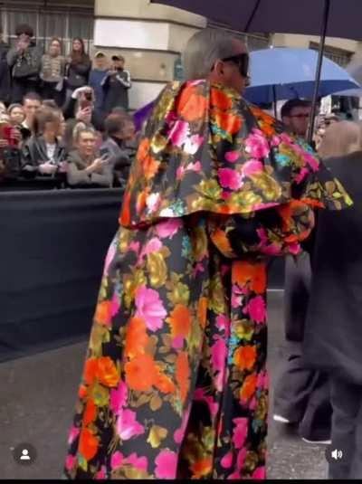 A not so impressed security guard at Paris Fashion Week