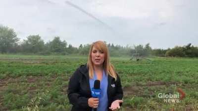 WCGW broadcasting news close to sprinkler