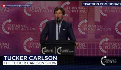 Tucker Carlson on stage describing what happens when Dad gets home.