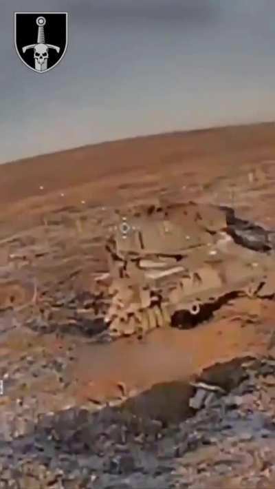 FPV drone hits Russian infantry hiding behind destroyed Leopard 2A4 MBT