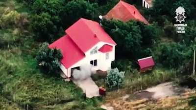 Russian occupier parked in the garage of a residential building. Drone flys into garage and invader flys out.