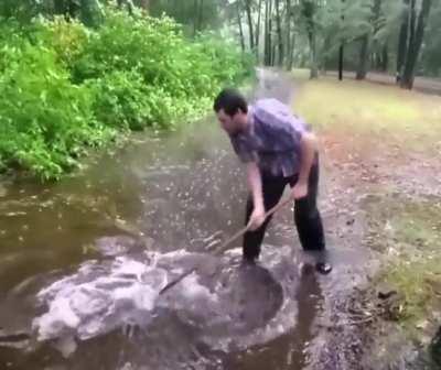 Unclogging the drain at the park