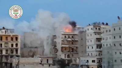 FSA 16th Division &quot;Hell Cannon&quot; strike on a sandbagged Syrian Army rooftop position - Ashrafieh, Aleppo - 5/10/2014