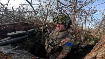 Soldier of the 47th Brigade in position. Fighting is audible in the background. Close arrival of the Grad barrage At 1:17. Svatove, December, 2023.