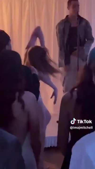 This girl dancing like a crazy person at a wedding