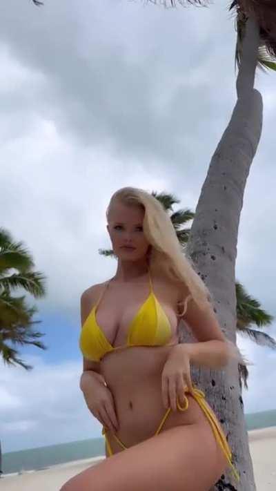 Showing off her yellow bikini