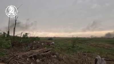 Ukrainian fighters from 47th Mechanised Brigade being protected by Leopard 2 tank and Bradley IFV 