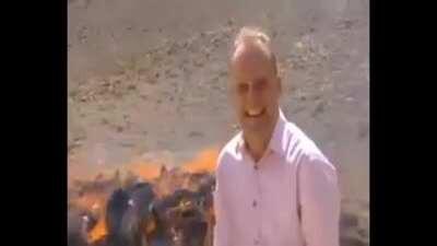 “Burning behind me is 8.5 tons of heroin, opium, hashish and other narcotics... hehehehehehe”