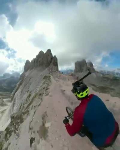 Mountain biking next to sheer cliffs