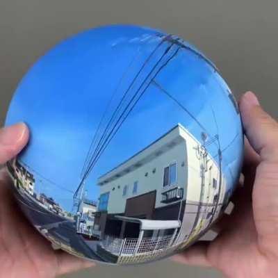 A 360° painted sphere of a street view