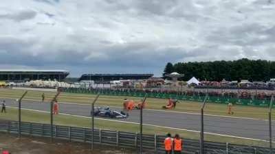 Activists of Just Stop Oil protest by sitting on the track at F1 British Grand Prix 2022